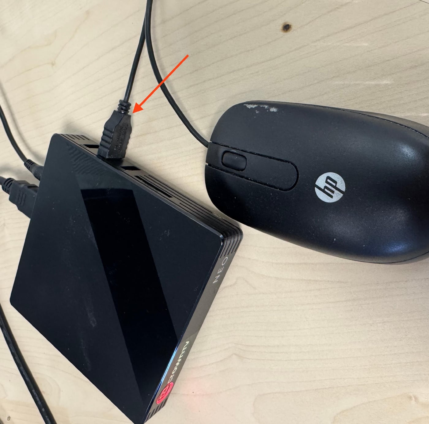 Mouse plugged into the black USB port on the side of the media player