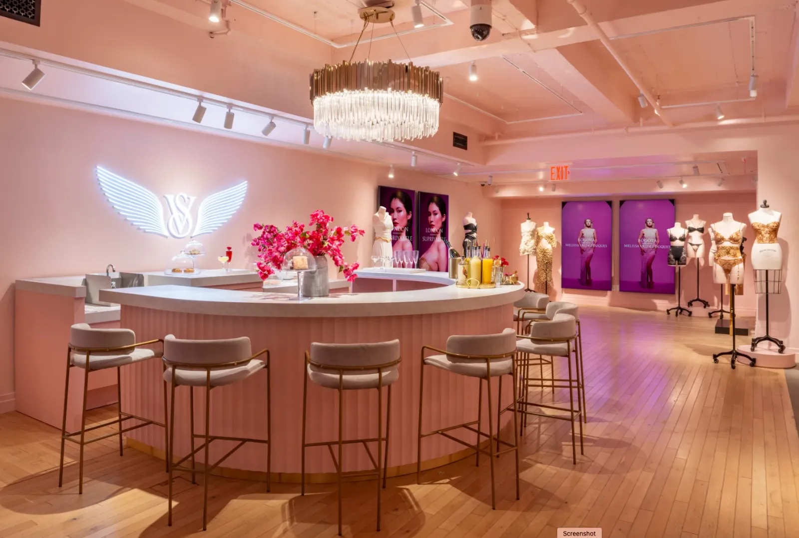 Victoria's Secret & PINK Fifth Avenue flagship — curved champagne bar with portrait-orientation displays