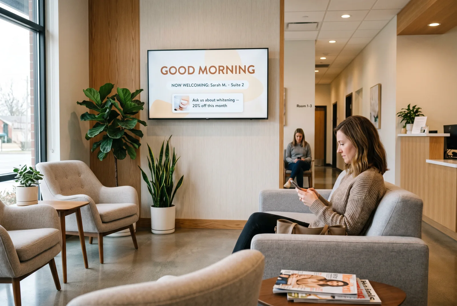 Dental office waiting room TV running a patient welcome board with practice branding