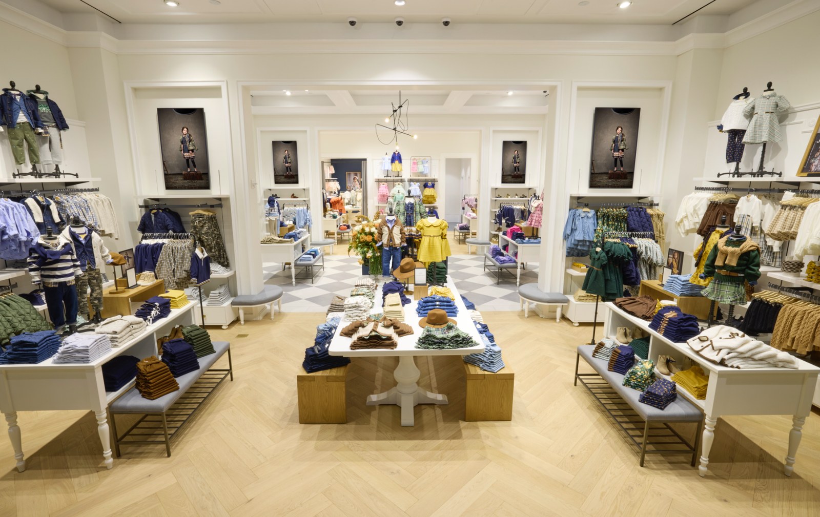 Samsung 4K display integrated into Janie and Jack's herringbone-and-millwork interior