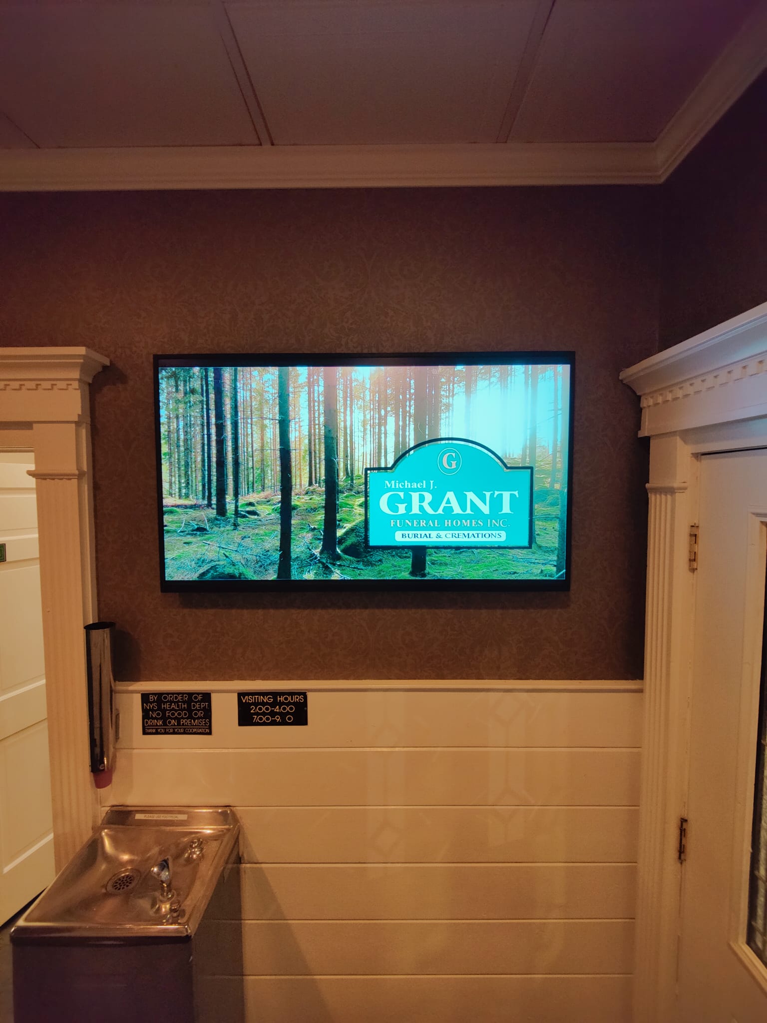 Grant Funeral Home digital display detail showing service information