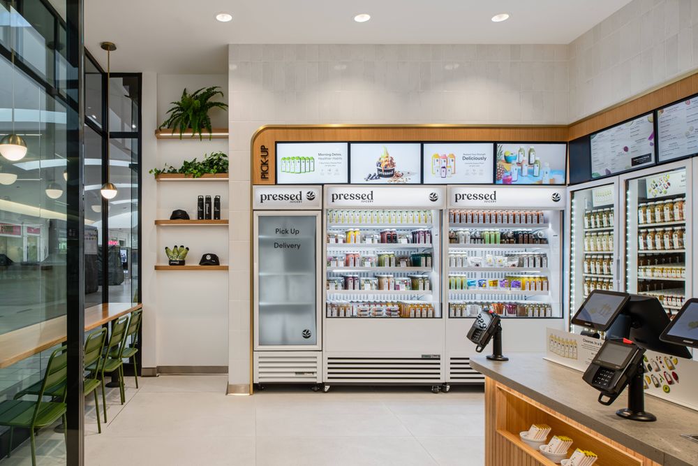 Pressed Juicery interior digital display showing seasonal specials